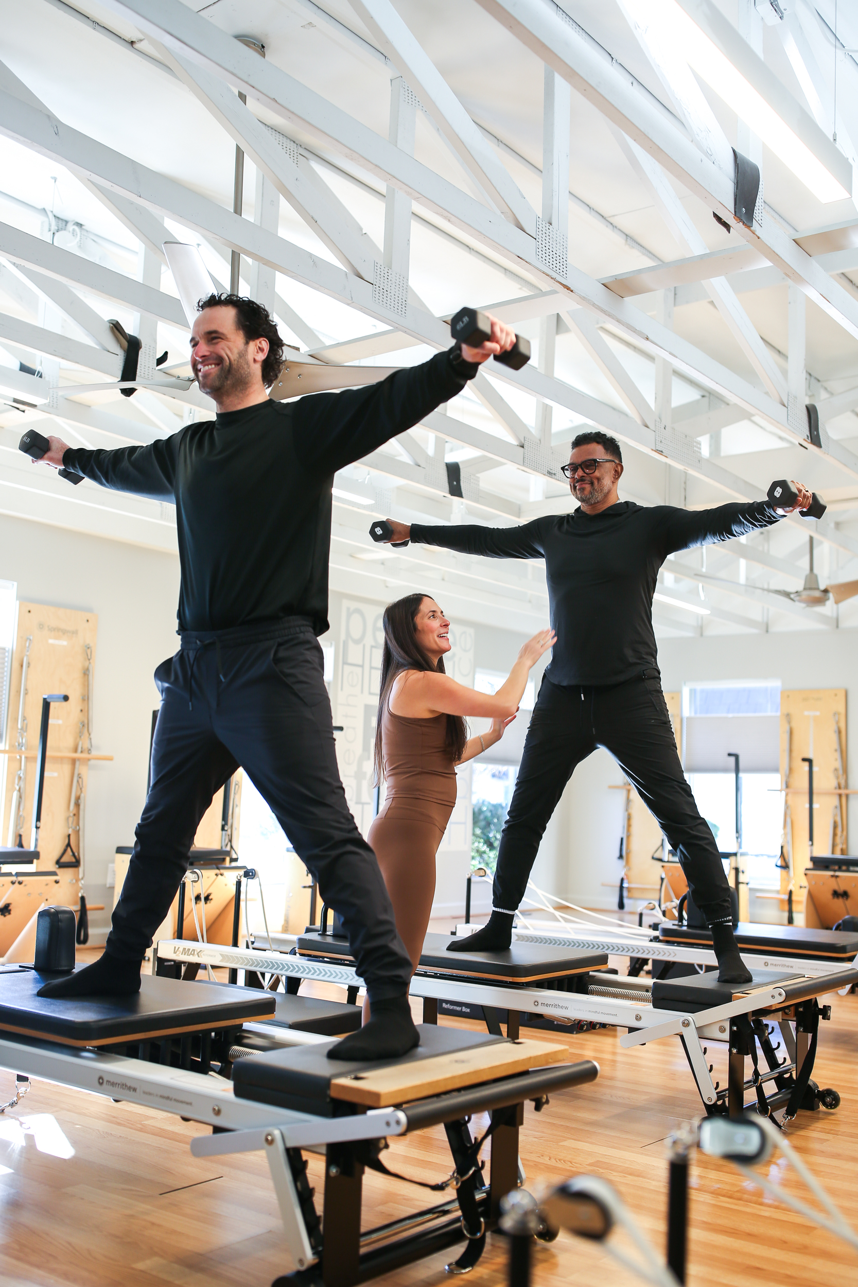 Instructor leading a Pilates session