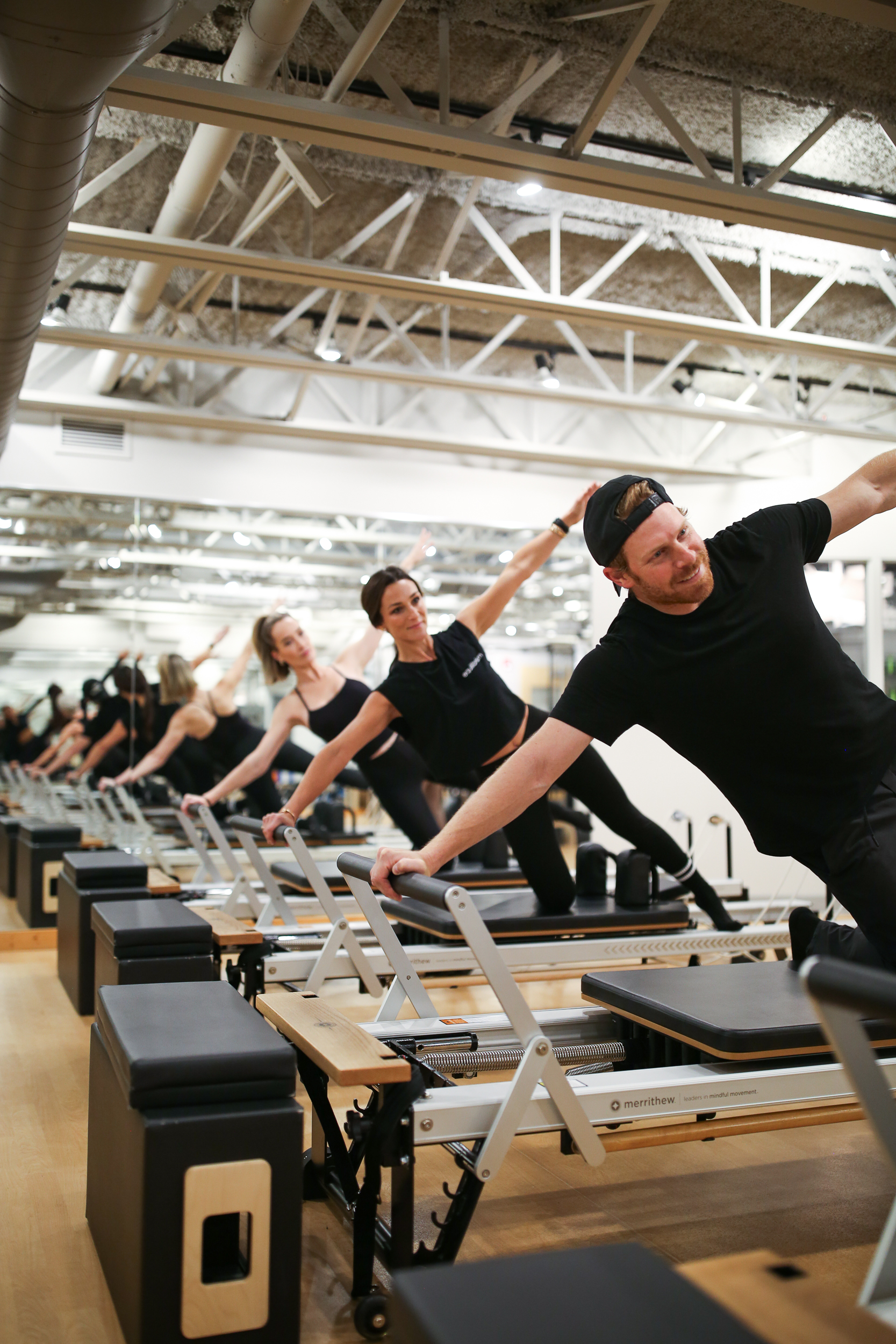 Instructor and client in a private Pilates session