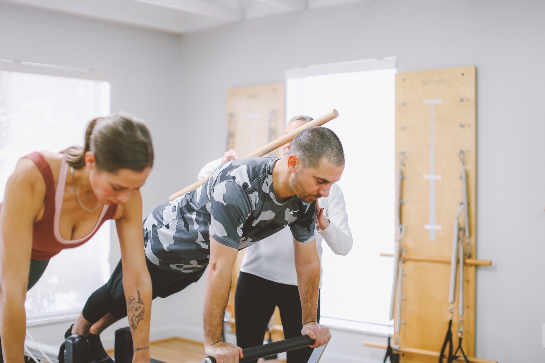 STOTT PILATES reformer session with instructor alignment cueing
